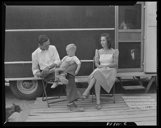 Untitled photo, possibly related to: Childersburg, Alabama. Mr. and Mrs. Peek of Georgia take it easy after the day's work in front of the trailer they bought for thirteen hundred dollars just to have a place to live