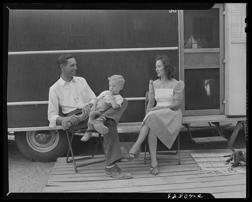 Childersburg, Alabama. Mr. and Mrs. Peek of Georgia take it easy after the day's work in front of the trailer they bought for thirteen hundred dollars just to have a place to live