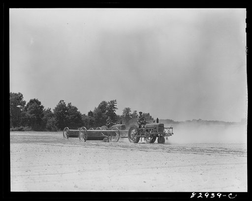 Untitled photo, possibly related to: Bridgeton, New Jersey. Seabrook Farm. Spreading chemical fertilizer