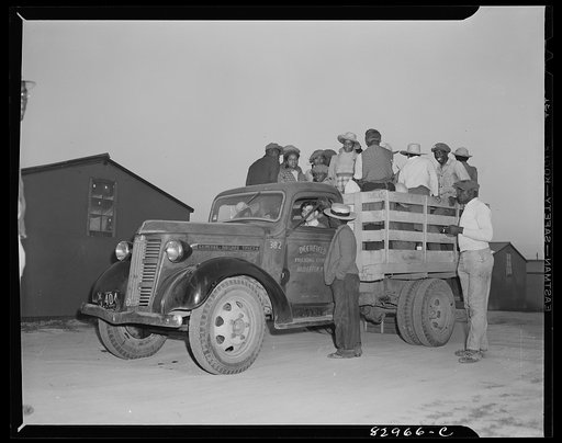 Untitled photo, possibly related to: Bridgeton, New Jersey. FSA (Farm Security Administration) agricultural workers' camp. Migrants leaving camp for fields at 5:30 a.m.
