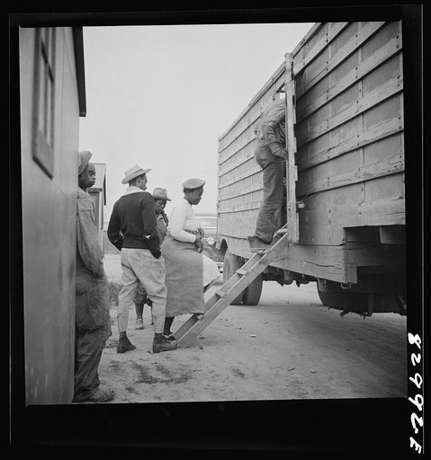 Bridgeton, New Jersey. FSA (Farm Security Administration) agricultural workers' camp. Migrant leaving camp for the fields at 5:30 a.m.