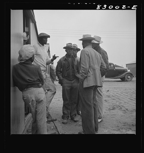 Untitled photo, possibly related to: Bridgeton, New Jersey. FSA (Farm Security Administration) agricultural workers' camp. Talking things over