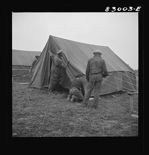 Untitled photo, possibly related to: Bridgeton, New Jersey. FSA (Farm Security Administration) agricultural workers' camp. Setting up tents