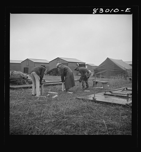 Untitled photo, possibly related to: Bridgeton, New Jersey. FSA (Farm Security Administration) agricultural workers' camp. Setting up tents