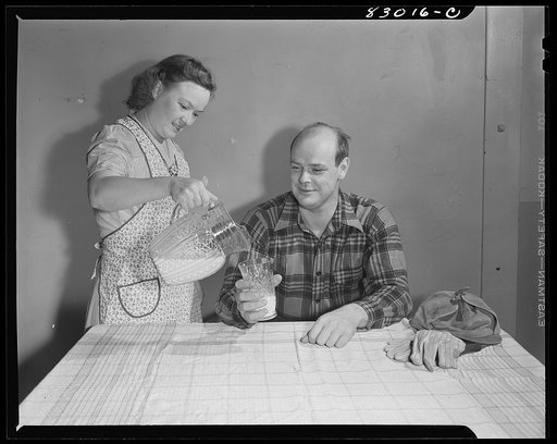 Untitled photo, possibly related to: Bridgeton, New Jersey. Seabrook Farm. Man drinking milk