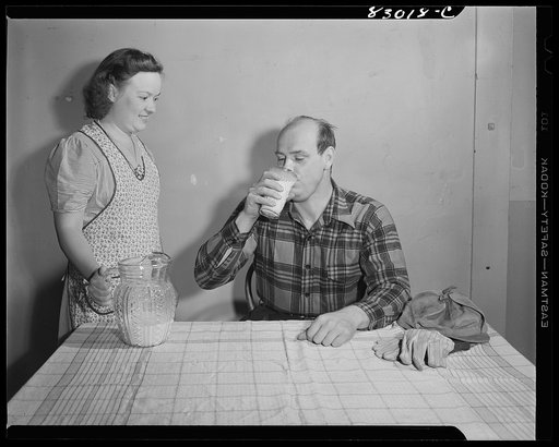 Untitled photo, possibly related to: Bridgeton, New Jersey. Seabrook Farm. Man drinking milk
