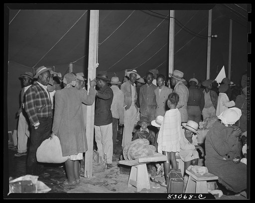 Bridgeton, N.J. FSA (Farm Security Administration) agricultural workers' camp. The newcomers were led into the recreation tent, where amid their damp bundles they waited for daylight