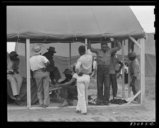 Untitled photo, possibly related to: Bridgeton, New Jersey. FSA (Farm Security Administration) agricultural workers' camp. Camp bootblack stand on a Sunday morning