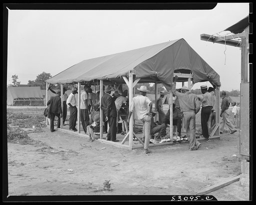 Bridgeton, New Jersey. FSA (Farm Security Administration) agricultural workers' camp. Sunday morning in the shoeshine parlor