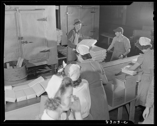 Untitled photo, possibly related to: Bridgeton, New Jersey. Seabrook Farm. Frozen food coming out of the quick freezer