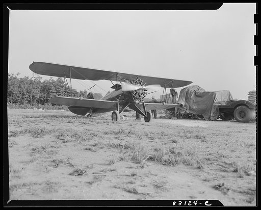 Untitled photo, possibly related to: Bridgeton, New Jersey. Seabrook Farm. Dusting with an airplane. Dust or insecticide is spread by low flying planes onto crops to control various insect pests