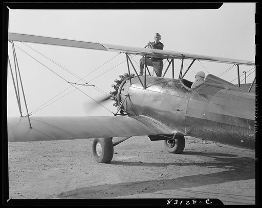 Bridgeton, New Jersey. Seabrook Farm. Loading gasoline into a dusting plane. Dust or insecticide is spread by low flying planes onto crops to control various insect pests