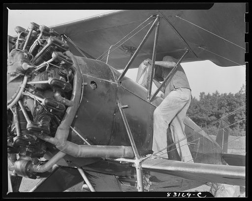 Bridgeton, New Jersey. Seabrook Farm. Loading dust into a plane. Dust or insecticide is spread by low flying planes onto crops to control various insect pests