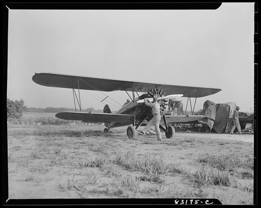 Bridgeton, New Jersey. Seabrook Farm. Dusting plane. Dust or insecticide is spread by low flying planes onto crops to control various insect pests