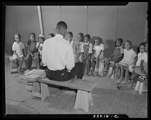 Untitled photo, possibly related to: Bridgeton, New Jersey. FSA (Farm Security Administration) agricultural workers' camp. Bible class is held in the big recreation tent every morning of the week