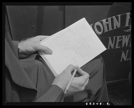 Untitled photo, possibly related to: Bridgeton, New Jersey. United States employment agent writing out the contract for John Hanby, freeholder farmer who has contracted for pickers