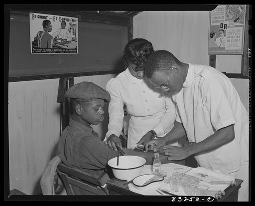 Bridgeton, New Jersey. FSA (Farm Security Administration) agricultural workers' camp. Patients at the camp clinic receiving injections for the treatment of venereal diseases