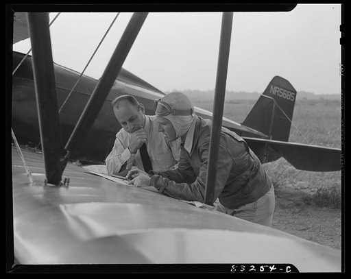 Bridgeton, New Jersey. Seabrook Farm. Laying out the fields for dusting. Dust or insecticide is spread by low flying planes onto crops to control various insect pests
