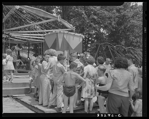 Untitled photo, possibly related to: Bridgeton, New Jersey. Getting tickets for merry-go-round Fourth of July picnic