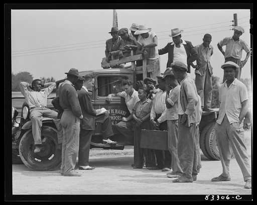 Untitled photo, possibly related to: Bridgeton, New Jersey. FSA (Farm Security Administration) agricultural workers' camp. George Price, United States employment agent writing up contract for the pickers whom John Hanby is taking to his own farm to live and work