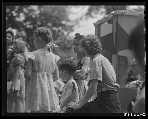 Untitled photo, possibly related to: Bridgeton, New Jersey. Getting tickets for merry-go-round Fourth of July picnic