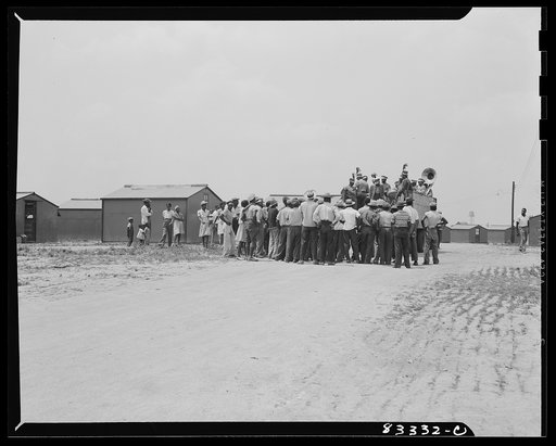 Untitled photo, possibly related to: Bridgeton, New Jersey. FSA (Farm Security Administration) agricultural workers' camp. Colored minstrels advertising their show