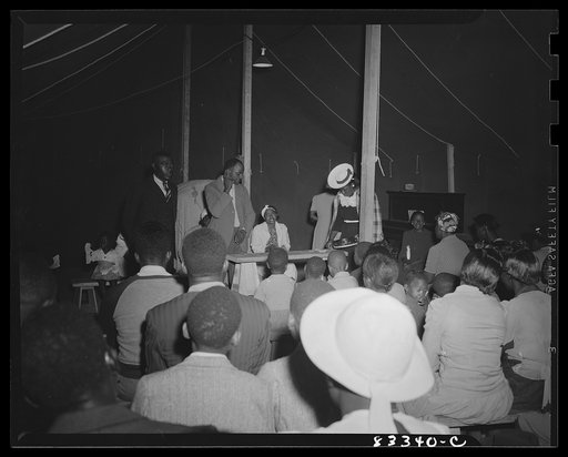 Untitled photo, possibly related to: Bridgeton, New Jersey. FSA (Farm Security Administration) agricultural workers' camp. Negro revivalist