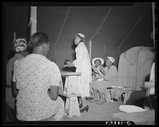 Untitled photo, possibly related to: Bridgeton, New Jersey. FSA (Farm Security Administration) agricultural workers' camp. Negro revivalist
