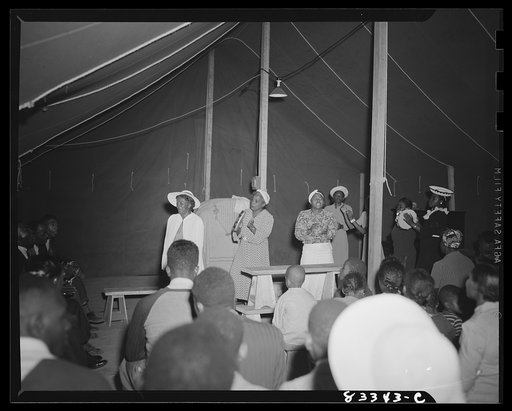 Untitled photo, possibly related to: Bridgeton, New Jersey. FSA (Farm Security Administration) agricultural workers' camp. Negro revivalist