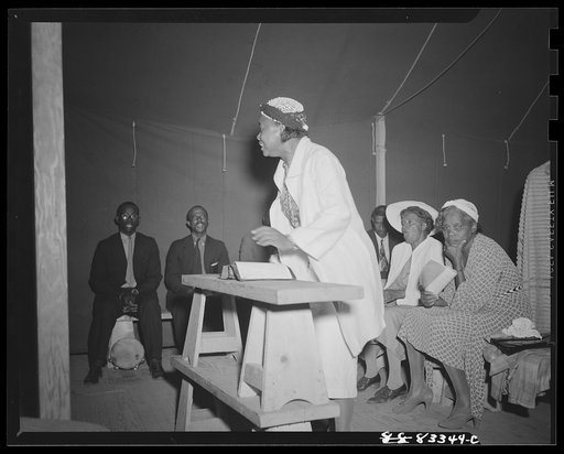 Untitled photo, possibly related to: Bridgeton, New Jersey. FSA (Farm Security Administration) agricultural workers' camp. Negro revivalist