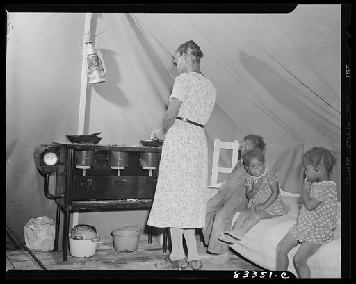 Bridgeton, New Jersey. FSA (Farm Security Administration) agricultural workers' camp. Cooking on kerosene stove