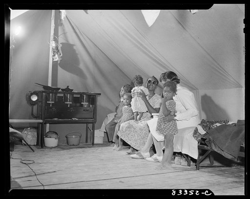 Untitled photo, possibly related to: Bridgeton, New Jersey. FSA (Farm Security Administration) agricultural workers' camp. Cooking on kerosene stove