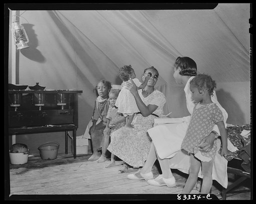 Untitled photo, possibly related to: Bridgeton, New Jersey. FSA (Farm Security Administration) agricultural workers' camp. Cooking on kerosene stove