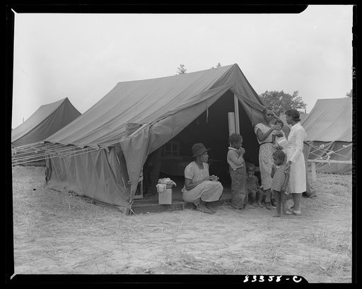 Untitled photo, possibly related to: Bridgeton, New Jersey. FSA (Farm Security Administration) agricultural workers' camp. The camp nurse making a call
