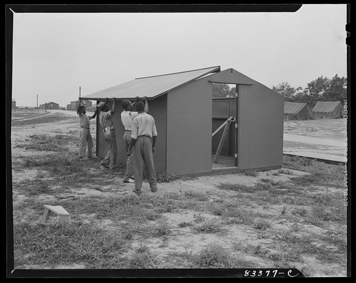 Bridgeton, New Jersey. FSA (Farm Security Administration) agricultural workers' camp. Putting up a prefabricated house made from materials not affected by wartime shortages