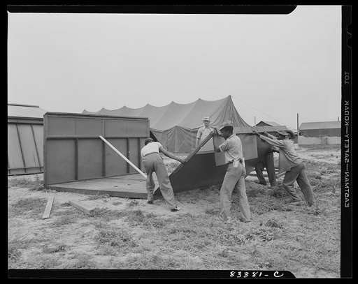 Bridgeton, New Jersey. FSA (Farm Security Administration) agricultural workers' camp. Putting up a prefabricated house made from materials not affected by wartime shortages