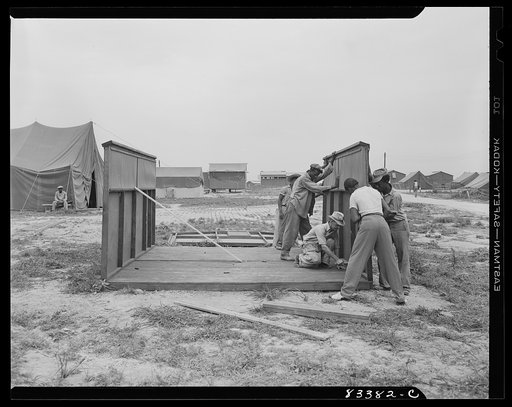 Bridgeton, New Jersey. FSA (Farm Security Administration) agricultural workers' camp. Putting up a prefabricated house made from materials not affected by wartime shortages