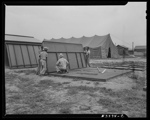 Untitled photo, possibly related to: Bridgeton, New Jersey. FSA (Farm Security Administration) agricultural workers' camp. Putting up a prefabricated house made from materials not affected by wartime shortages