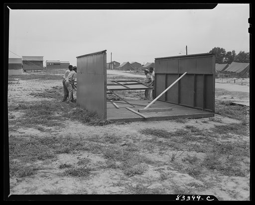 Bridgeton, New Jersey. FSA (Farm Security Administration) agricultural workers' camp. Putting up a prefabricated house made from materials not affected by wartime shortages