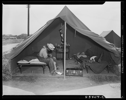 Bridgeton, New Jersey. FSA (Farm Security Administration) agricultural workers' camp. Single men live in the tents; families live in the houses
