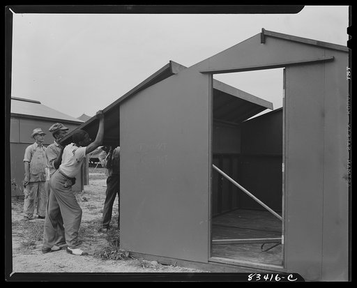 Bridgeton, New Jersey. FSA (Farm Security Administration) agricultural workers' camp. Putting up a prefabricated house made from materials not affected by wartime shortages