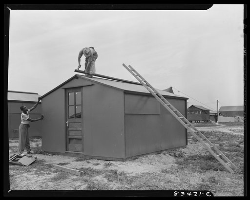 Bridgeton, New Jersey. FSA (Farm Security Administration) agricultural workers' camp. Putting up a prefabricated house made from materials not affected by wartime shortages