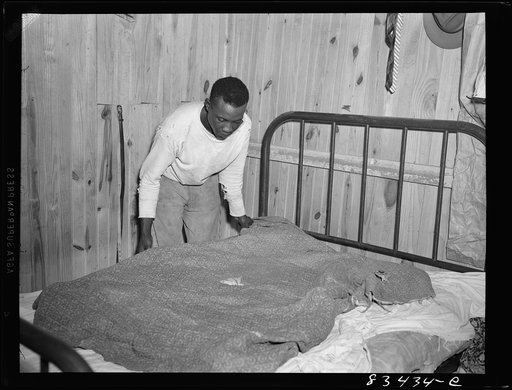 Bridgeton, New Jersey. Migrant who lives alone in a barn on the farm where he works