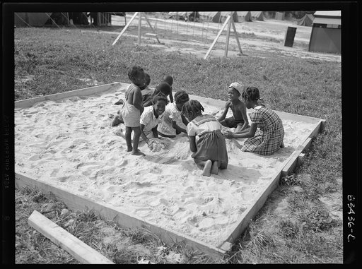 Bridgeton, New Jersey. FSA (Farm Security Administration) agricultural workers' camp. The children are discouraged from going to the fields, but told to stay around camp where they can play safely