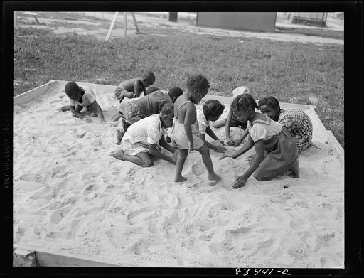 Untitled photo, possibly related to: Bridgeton, New Jersey. FSA (Farm Security Administration) agricultural workers' camp. The children are discouraged from going to the fields, but told to stay around camp where they can play safely