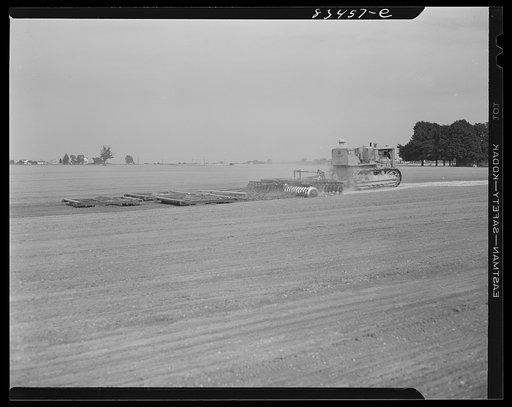 Untitled photo, possibly related to: Harrowing fields with diesel tractors at Seabrook Farms. Bridgeton, New Jersey