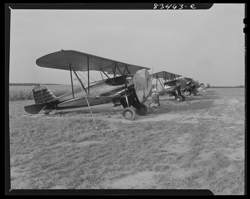 Untitled photo, possibly related to: Bridgeton, New Jersey. Seabrook Farm. Dusting plane. Dust or insecticide is spread by low flying planes onto crops to control various insect pests