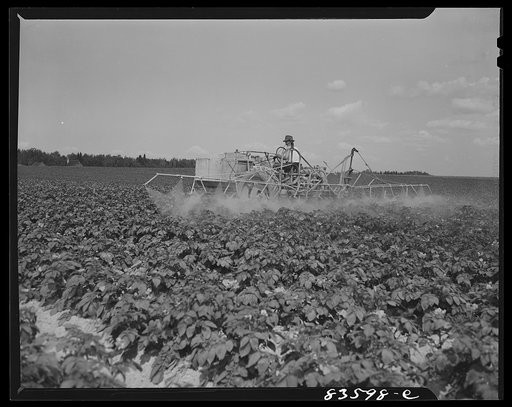 Aroostook County, Maine. Mechanized sprayer on the land which once belonged to Belonie Dufour and is now owned by Berce and Clark land company