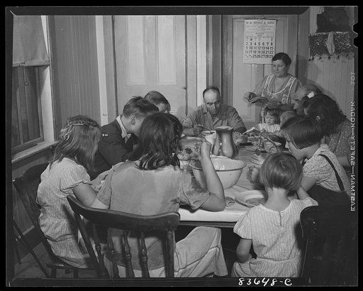 Fort Kent, Maine (vicinity). Albert [i.e. Leonard] Gagnon and his family sitting down to lunch