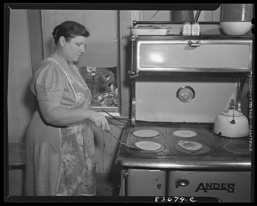 Fort Kent, Maine. (vicinity). Mrs. [Leonard] Gagnon making buckwheat pancakes